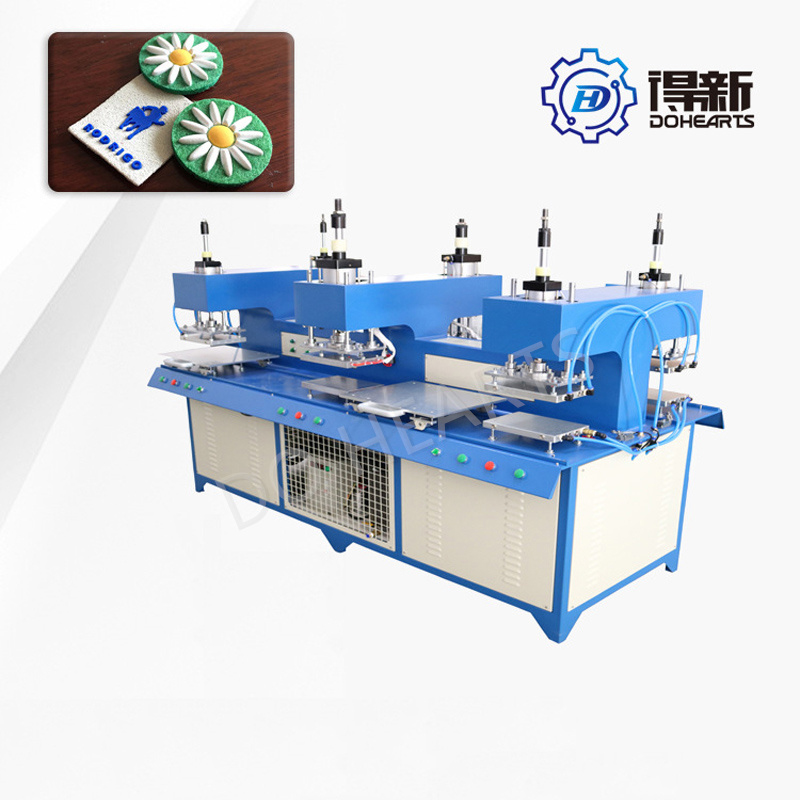 中国の衣料品商標成形機ファブリックラベルエンボス加工装置